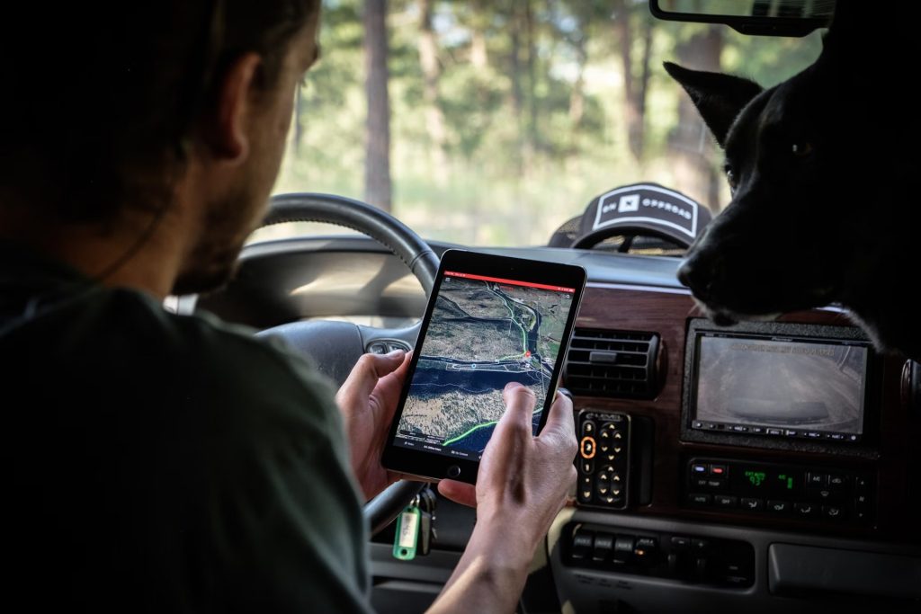 Man holding pad in car with GPS turned on